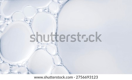 Clear liquid bubbles macro abstract water texture transparent fluid surface minimal clean background soft light close up science cosmetic serum texture.