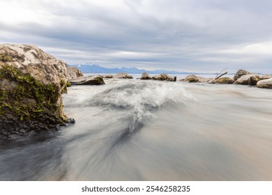 Clear mountain panorama at serene lakeshore at Chiemsee - Powered by Shutterstock