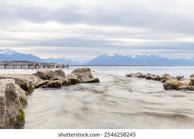 Clear mountain panorama at serene lakeshore at Chiemsee - Powered by Shutterstock