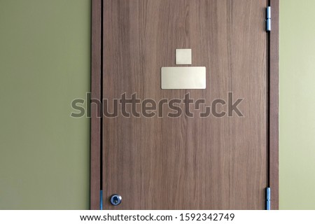 Clear nameplate on the door with lock. Room for text for name and number. Conceptual photo 