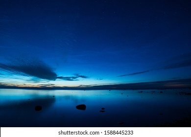 Clear night with stars on dark blue sky over the Baltic Sea, Sweden
