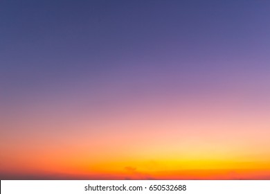 Clear Orange Yellow Sky Background With Blue Clouds Sunset Or Sunrise Morning Abstract Texture.