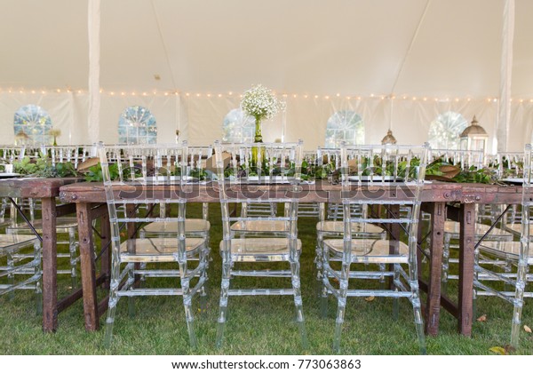 Clear Plastic Chiavari Chairs Paired Rustic Royalty Free Stock Image