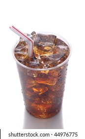 Clear Plastic Cup With Soda Ice And Straw Isolated On White With Reflection Vertical Format