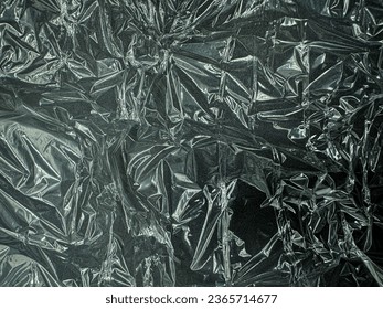 Clear plastic texture, black background.