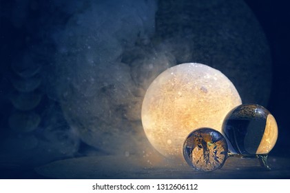 Clear quartz balls and glow moon lamp on abstract dark background. Esbat, Moon Ritual, wiccan witchcraft. spiritual esoteric practice. mystical Fortune teller ball. Magic ritual for summoning spirits - Powered by Shutterstock