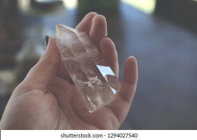 Clear Quartz crystal tower, carved crystal tower. Woman's hand holding clear quartz tower. Witchy decor, bohemian vibes. crystal healing, meditation crystals. Healing witch.