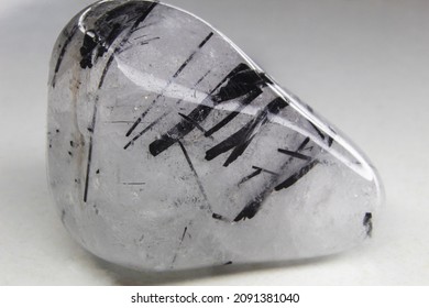 Clear quartz with tourmaline inclusions tumbled stone. tourmaline quartz tumbled stone