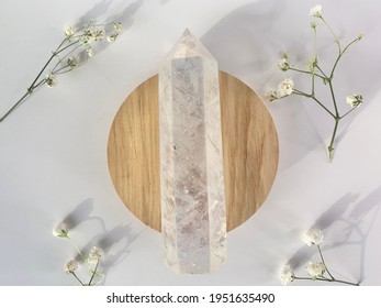 Clear Quartz Tower Point Crystal Wood Circle White Background 