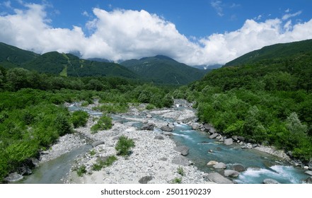 Clear river of snow melted water in the mountain range. White water river stream. - Powered by Shutterstock