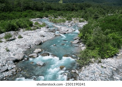 Clear river of snow melted water in the mountain range. White water river stream. - Powered by Shutterstock