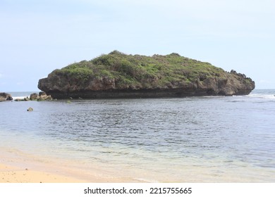 Clear Sea Waters And Green Hills