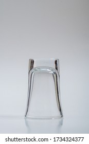 Clear Shot Glass Upside Down On A White Background