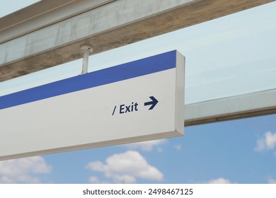 Clear Signage Indicating Exit Direction at Transportation Facility for Better Passenger Navigation