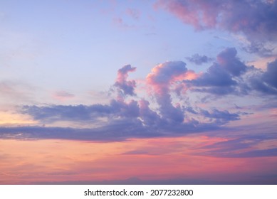 Clear sky, glowing cirrus and cumulus clouds after the storm, soft sunlight. Dramatic sunset cloudscape. Meteorology, weather, climate, heaven, peace. Graphic resources. Picturesque panoramic scenery - Shutterstock ID 2077232800
