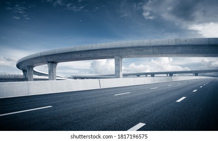 Clear sky, highway pavement under the overpass - Shutterstock ID 1817196575