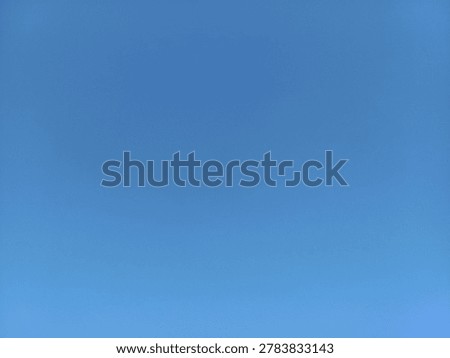 Clear and solid blue sky background without clouds