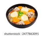 Clear soup with tofu and minced pork in black bowl isolated on white background. Clipping path