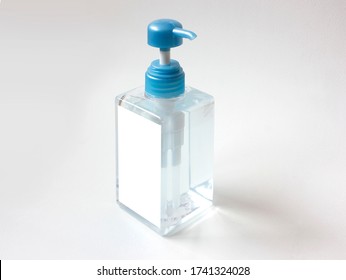 Clear Square Shape Bottle Mockup With Blue Cap On Isolated White Background.