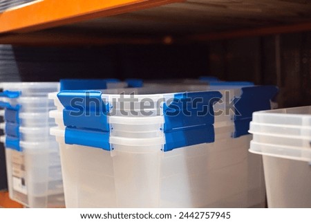 Clear storage boxes with durable latches lids, comfortable grip for carrying display at hardware home improvement store in Dallas, Texas, see-through, clarified polypropylene clear base container. USA