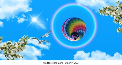 Clear Sunny Sky, White Clouds And Flying Seagulls. Colorful Hot Air Balloon And Round Rainbow In The Blue Sky. White Spring Flowers. Bottom View Stretch Ceiling Sky Picture.