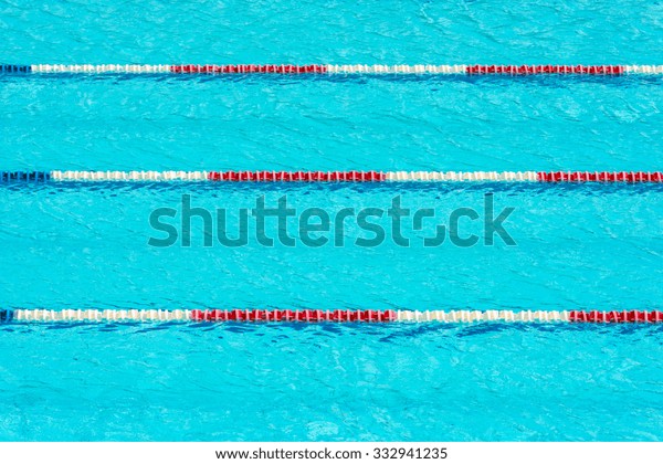 Clear transparent swimming pool water background.\
Horizontal shot