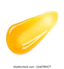Clear transparent yellow face cream smear smudge, golden sugar honey isolated on white background top view.