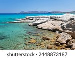 Clear turquoise sea and volcanic rock formations at Sarakiniko, Sarakiniko, Milos, Cyclades, Aegean Sea, Greek Islands, Greece, Europe