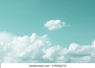 clear turquoise sky with simple white cloud with space for text background.