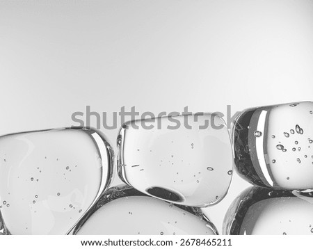 Clear water bubbles floating on a pristine white surface, capturing light reflections.