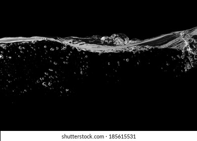 Clear Water Surface On A Black With Ripple And Bubbles