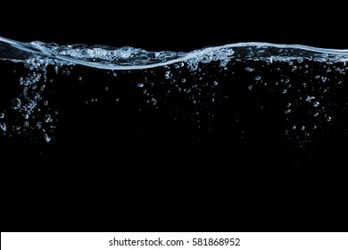 Clear water surface on a black with ripple and bubbles