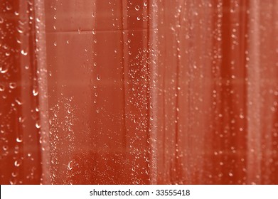 Clear Wet Shower Curtain With Tiles In Background