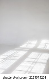 Clear white cyclorama. Light background with sun light and shadows. Plain wall empty photo studio. . High quality photo - Shutterstock ID 2223575231