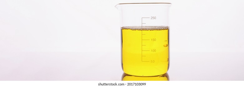 Clear Yellow Liquid Is Poured Into Beaker