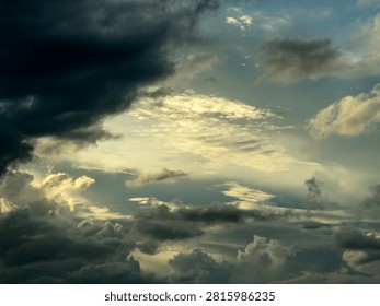 Clearing sky with light winds and erratic conditions after a thunderstorm on a summer evening in Florida. Motifs of chaotic systems and disquiet, complex dynamics in transition, yin and yang.