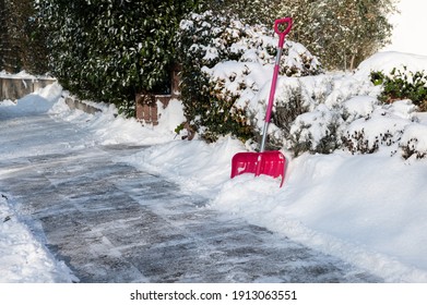 Clearing Snow On The Sidewalk