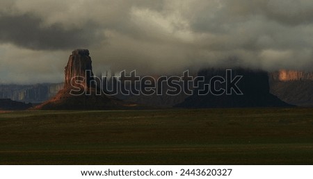 Similar – Image, Stock Photo Dramatic storm over Monument Valley road