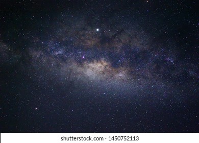 Clearly milky way galaxy at night. Image contains noise and grain due to high ISO. Image also contains soft focus and blur due to long exposure and wide aperture. - Shutterstock ID 1450752113