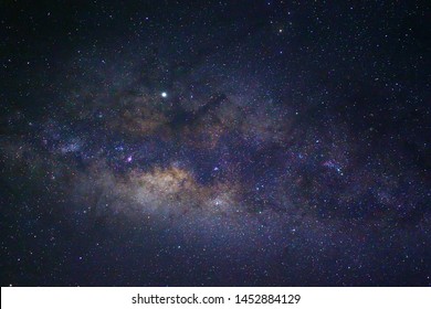 Clearly Milky Way Galaxy in the night sky. Image contains noise and grain due to high ISO. Image also contains soft focus and blur due to long exposure and wide aperture - Shutterstock ID 1452884129