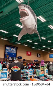 Clearwater Beach, Florida, USA 11/8/19 A Fake Great White Shark Hanging Overhead Of Clothing In The Surf Style Store