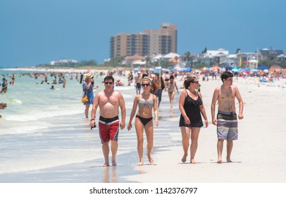 Clearwater Beach, FL/USA- 07/15/2018: A Family With College Aged  Children Walk Along Clearwater Beach. 