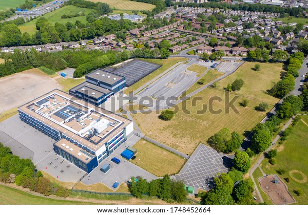 Cleckheaton UK,\
29th May 2020: Aerial drone photo of the Whitcliffe Mount Primary\
School, showing an aerial photo of the British school building on a\
bright sunny summers\
day