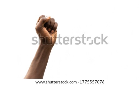 Clenched Fist Up in the Air. Black Person Hand Close Up Shot. Protest for Racial Discrimination. Isolated on White Background with Copy Space Area.