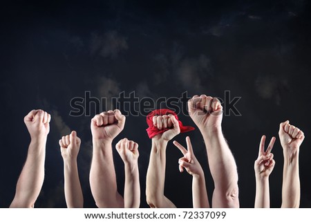 Clenched fists raised in protest