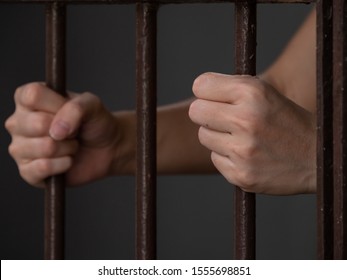 Clenched Hands Of Women In Prison.