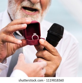 Clergy Showing The Wedding Ring