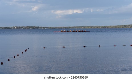 Clermont, FL USA 3-9-2022: Rowing Team Chugging Across Lake Minneola On The Clermont Chain Of Lakes.