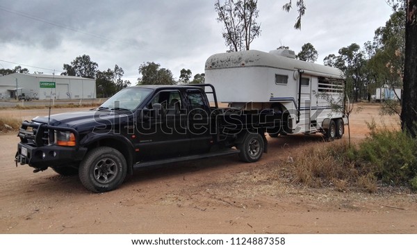 Clermont, Queensland, Australia, July 1st\
2018, Large utility vehicle towing horse\
float