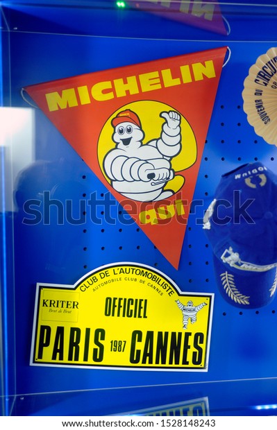 CLERMONT-FERRAND,\
FRANCE - SEPTEMBER 4, 2019: Michelin promotional items on display\
at the brand museum in\
Clermont-Ferrand